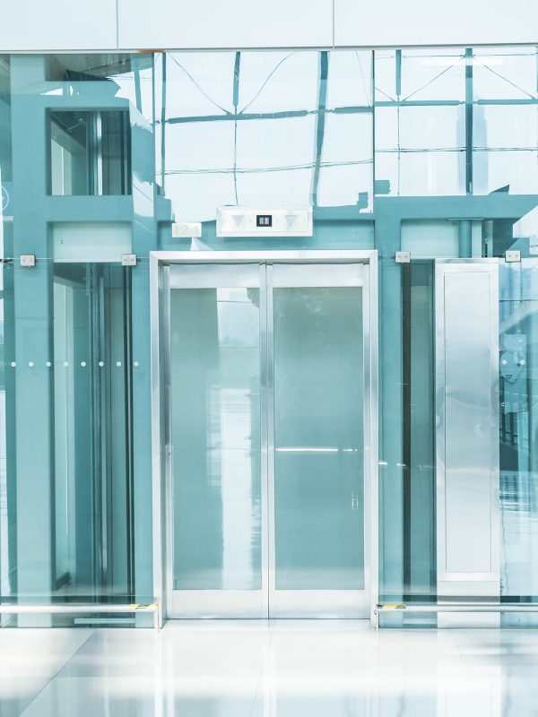 Transparent elevator in underground passage - blue white balance processing