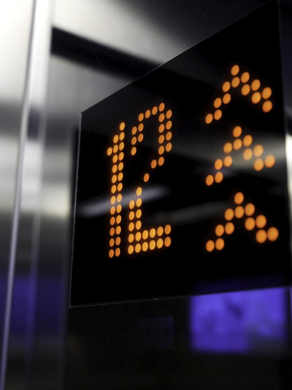 In elevator of modern business center on electronic LCD display. Interior of the elevator inside. View of the panel with the number and steel silver lining. monitor show number floor in elevator 4K